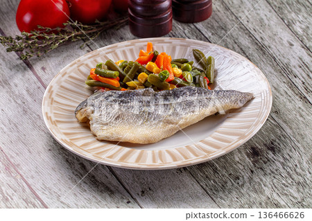 Steamed seabass fish fillet with vegetables 136466626