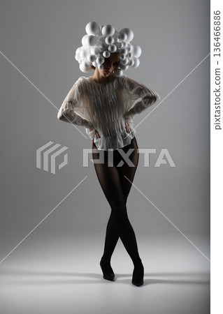 Fashion model posing wearing avant-garde bubble headpiece Fashion model posing wearing avant-garde bubble headpiece 136466886