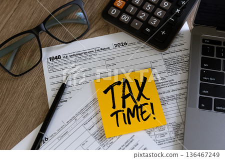 Tax time reminder concept paperwork, calculator and TAX TIME note , representing tax filing preparation, accounting services, audit readiness and financial documentation review. Tax time reminder concept paperwork, calculator and TAX TIME note , representing tax filing preparation, accounting services, audit readiness and financial documentation review. 136467249