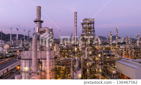 Aerial view oil and gas petrochemical storage tank with oil and gas refinery plant at twilight, Global business power and energy petrochemical industry, Oil and gas refinery petrochemical industrial. Aerial view oil and gas petrochemical storage tank with oil and gas refinery plant at twilight, Global business power and energy petrochemical industry, Oil and gas refinery petrochemical industrial. 136467562