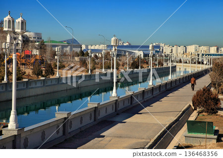 ASHGABAT, TURKMENISTAN, January 25, 2017:  Modern architecture of Ashgabat. View of the water channel. ASHGABAT, TURKMENISTAN, January 25, 2017. 136468356