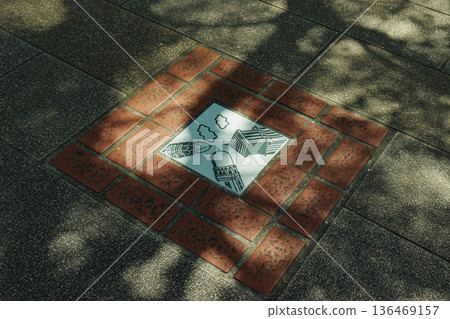 Sidewalk design tiles depicting the three Yokohama towers (King, Queen, Jack) 136469157