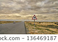 The sign of a camel. On the edge of the road crossing the Karakum desert in Turkmenistan. 136469187