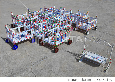 Turkmenistan. Ashkhabad market. Handmade baby carriages with colorful ornaments. 136469189