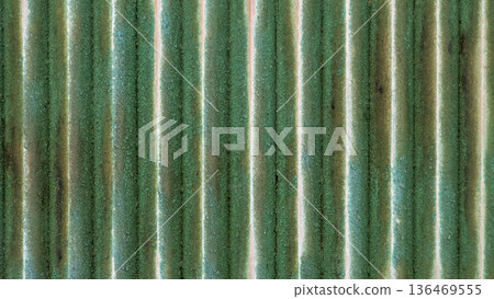 Texture of an old wooden wall with peeling green paint 136469555