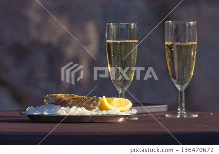 Oysters and champagne at outdoor Naplavka winter market 136470672