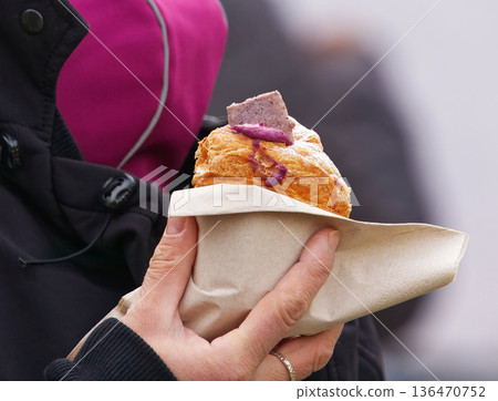 Fresh Muffin Held in Hand at Outdoor Market Fresh Muffin Held in Hand at Outdoor Market 136470752