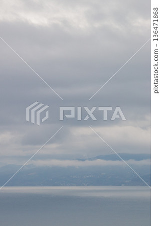 A calm lake and mountain landscape with sky and clouds after the rain A calm lake and mountain landscape with sky and clouds after the rain 136471868