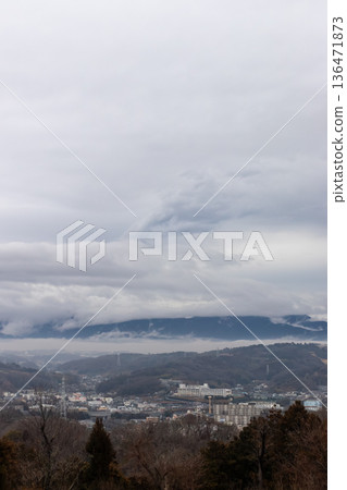 A calm lake and mountain landscape with sky and clouds after the rain A calm lake and mountain landscape with sky and clouds after the rain 136471873
