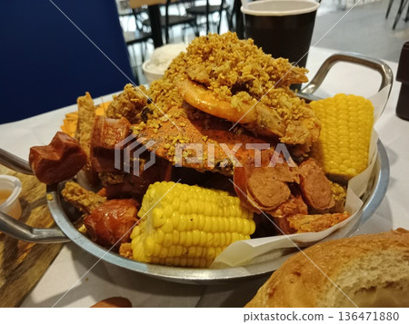 Fried crab shrimp sausage corn seafood feast. Fried crab shrimp sausage corn seafood feast. 136471880