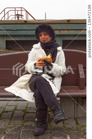 Winter street food moment at Naplavka farmers market in Prague Winter street food moment at Naplavka farmers market in Prague 136472186