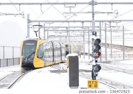 Utsunomiya Hiraishi Station "Light Rail and Snow Scenery" 136472925