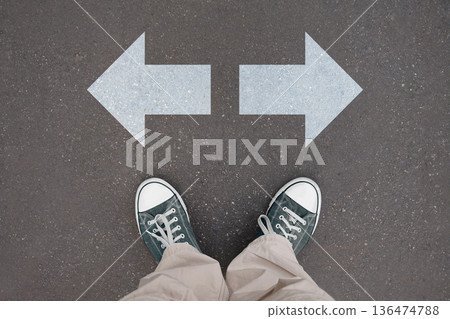 Two arrows - choice concept - legs with trainer shoes Two arrows - choice concept - legs with trainer shoes 136474788