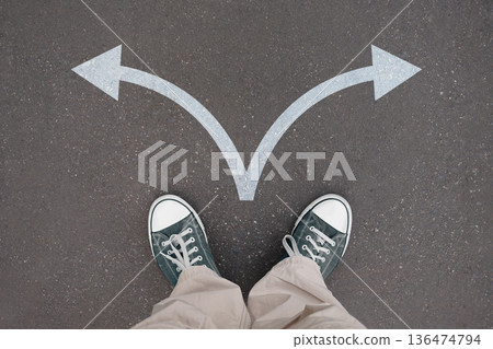 Two arrows - choice concept - legs with trainer shoes Two arrows - choice concept - legs with trainer shoes 136474794