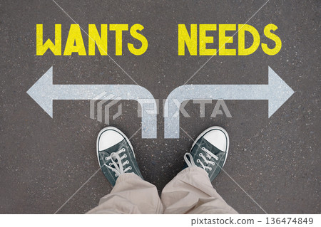 Needs and wants concept - legs with trainer shoes Needs and wants concept - legs with trainer shoes 136474849