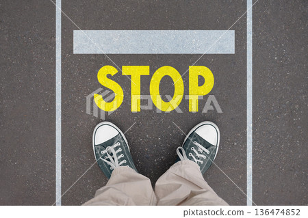 Stop concept - legs with trainer shoes Stop concept - legs with trainer shoes 136474852