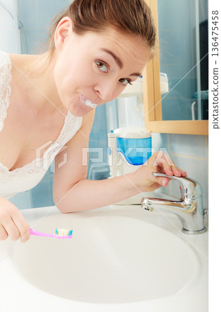 Woman brushing cleaning teeth. Oral hygiene. Woman brushing cleaning teeth. Oral hygiene. 136475458