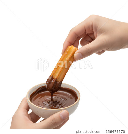 Hand dipping a warm, golden-brown, cinnamon-sugar churro into a cup of rich, thick melted chocolate sauce, isolated. Perfect for dessert lovers Hand dipping a warm, golden-brown, cinnamon-sugar churro into a cup of rich, thick melted chocolate sauce, isolated. Perfect for dessert lovers 136475570