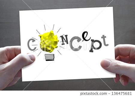 Paperball lightbulb, human hands holding piece of paper - idea, creativity concept 136475681