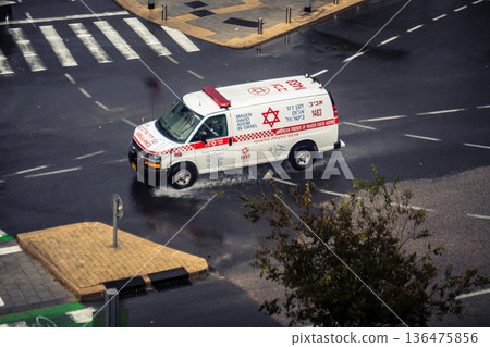 ambulance driving with emergency lights 136475856