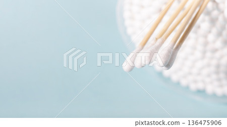 Cleaning tools cotton buds on blue background Cleaning tools cotton buds on blue background 136475906