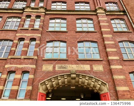 Manchester cityscape lined with brick buildings 136475996