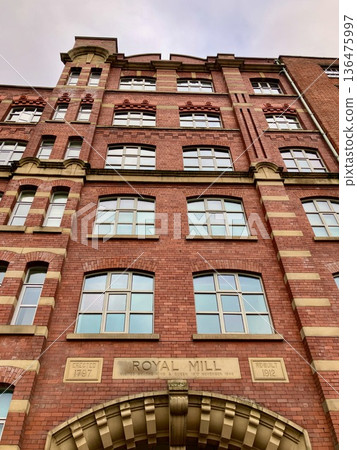 Manchester cityscape lined with brick buildings 136475997