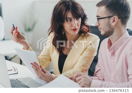 Business team in the office Business team in the office 136476315