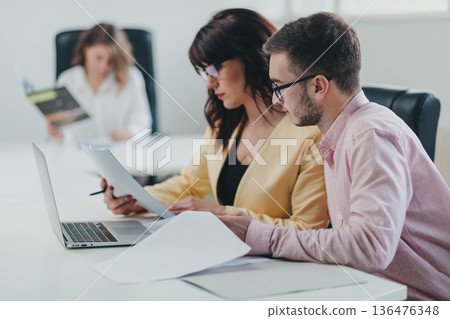 Business team in the office Business team in the office 136476348