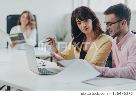 Business team in the office Business team in the office 136476376