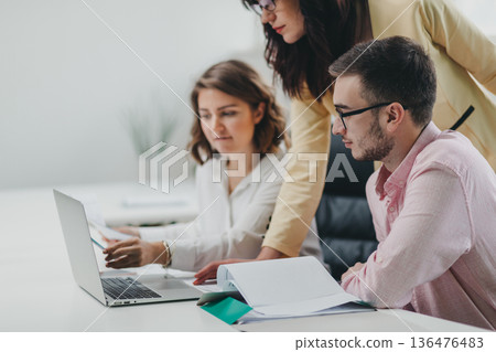 Business team in the office Business team in the office 136476483