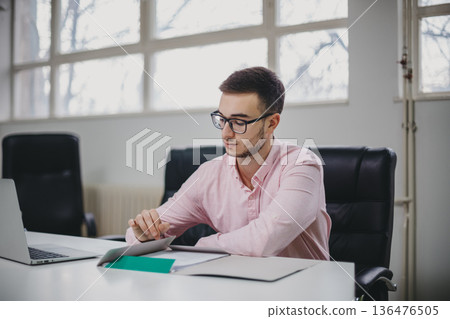 Young man in the office Young man in the office 136476505