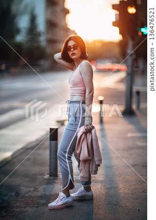 Young girl on street 136476521