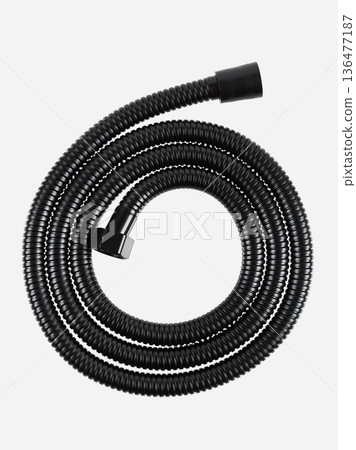Black shower hose is insulated on a white background. 136477187