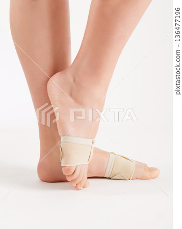Pads to support the foot on women's legs. Pads to support the foot on women's legs. 136477196