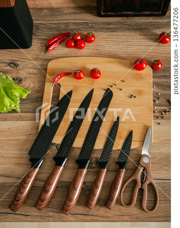 Beautiful set of knives on the background of the kitchen. 136477206