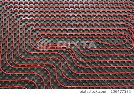 Tubes of radiant underfloor heating installation 136477583