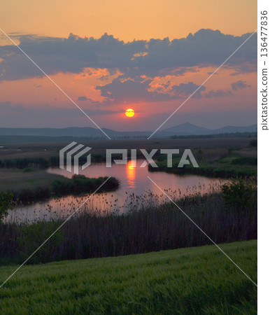 Sunset on Danube Delta in Romania Sunset on Danube Delta in Romania 136477836