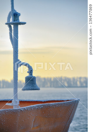 Frozen ship bell in winter time 136477869