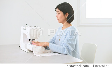 Sewing machine woman image 136478142