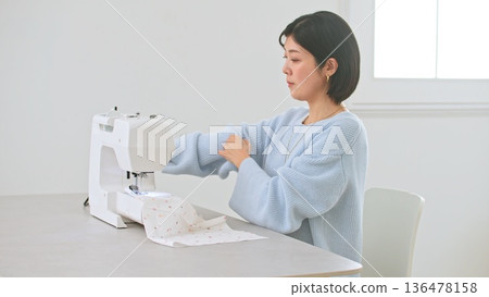 Sewing machine woman image 136478158
