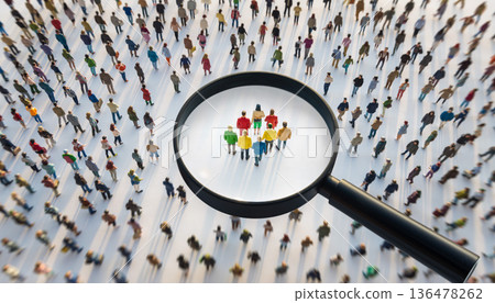 High angle view of large crowd with a magnifying glass focusing on a small group of people below in an outdoor space during daylight 136478262