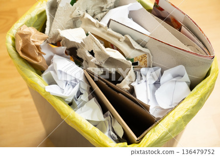 Waste Paper and Cardboard Sorting in Trash Bin for Recycling Waste Paper and Cardboard Sorting in Trash Bin for Recycling 136479752