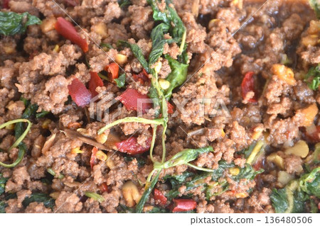 spicy stir fried chop beef meat with chili and basil in clear plastic box for take home on table 136480506
