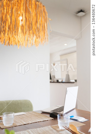 Living with a laptop at the dining table Living with a laptop at the dining table 136480672
