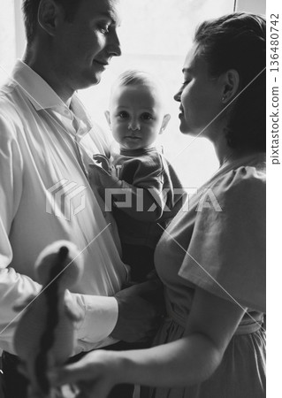 Family bond captured during a moment of affection 136480742