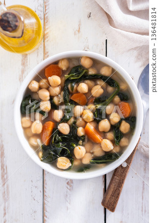 Chickpea and Spinach Soup with Carrots in White Bowl Chickpea and Spinach Soup with Carrots in White Bowl 136481814