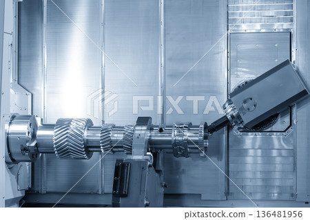 Multi-Tasking CNC Machine Milling Metal Gear Shaft Parts in Blue Tone Industrial Scene 136481956