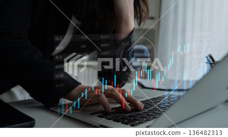 Business professional analyzing financial data and stock market trends on modern laptop in office environment with digital graphs and charts display Scalp Business professional analyzing financial data and stock market trends on modern laptop in office environment with digital graphs and charts display Scalp 136482313