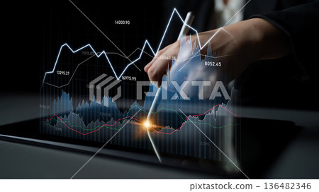Business professional analyzes financial data on tablet with dynamic charts and graphs, showcasing market trends and statistics for growth and strategy Scalp 136482346